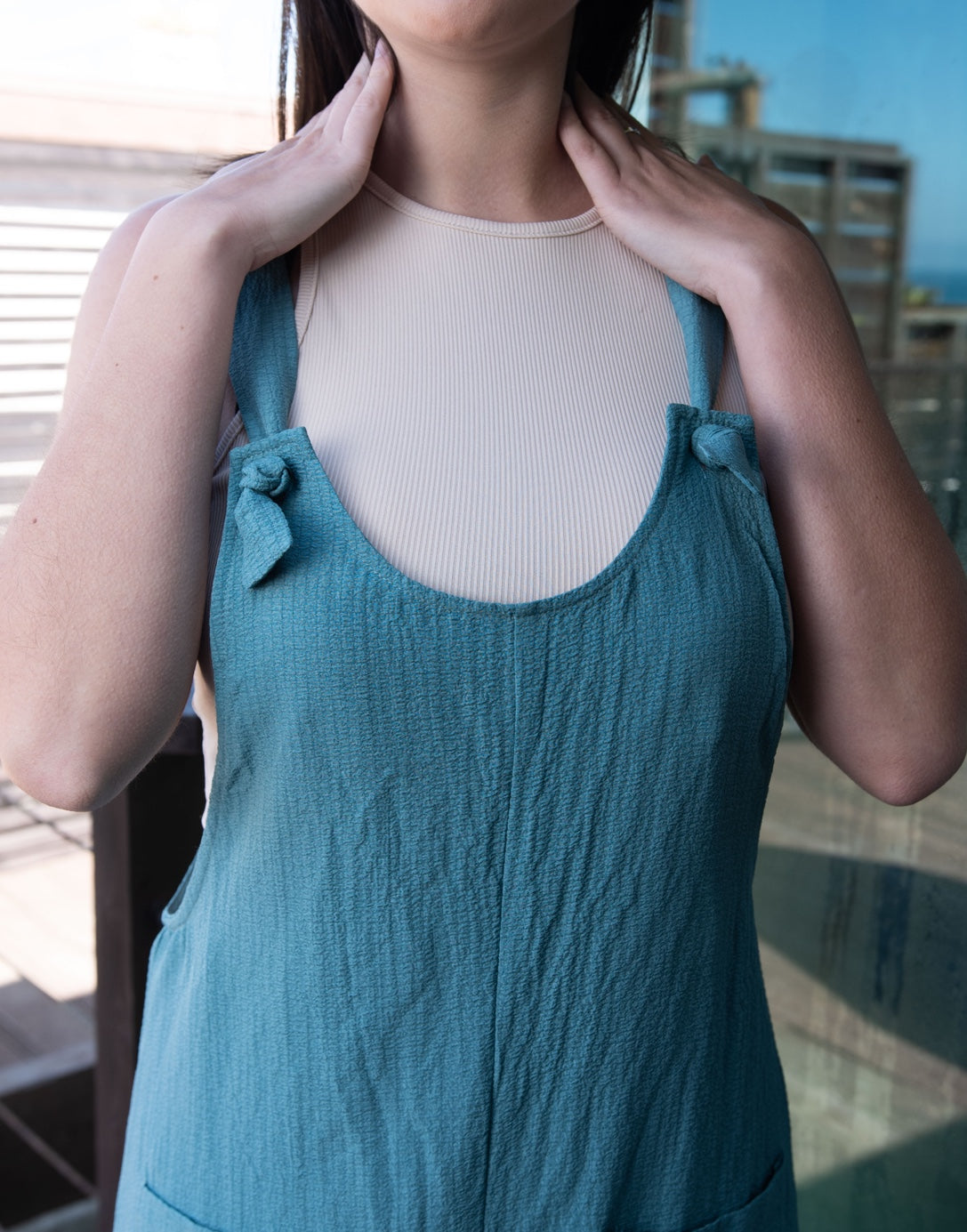Closeup of Overall Knot Straps Romper.