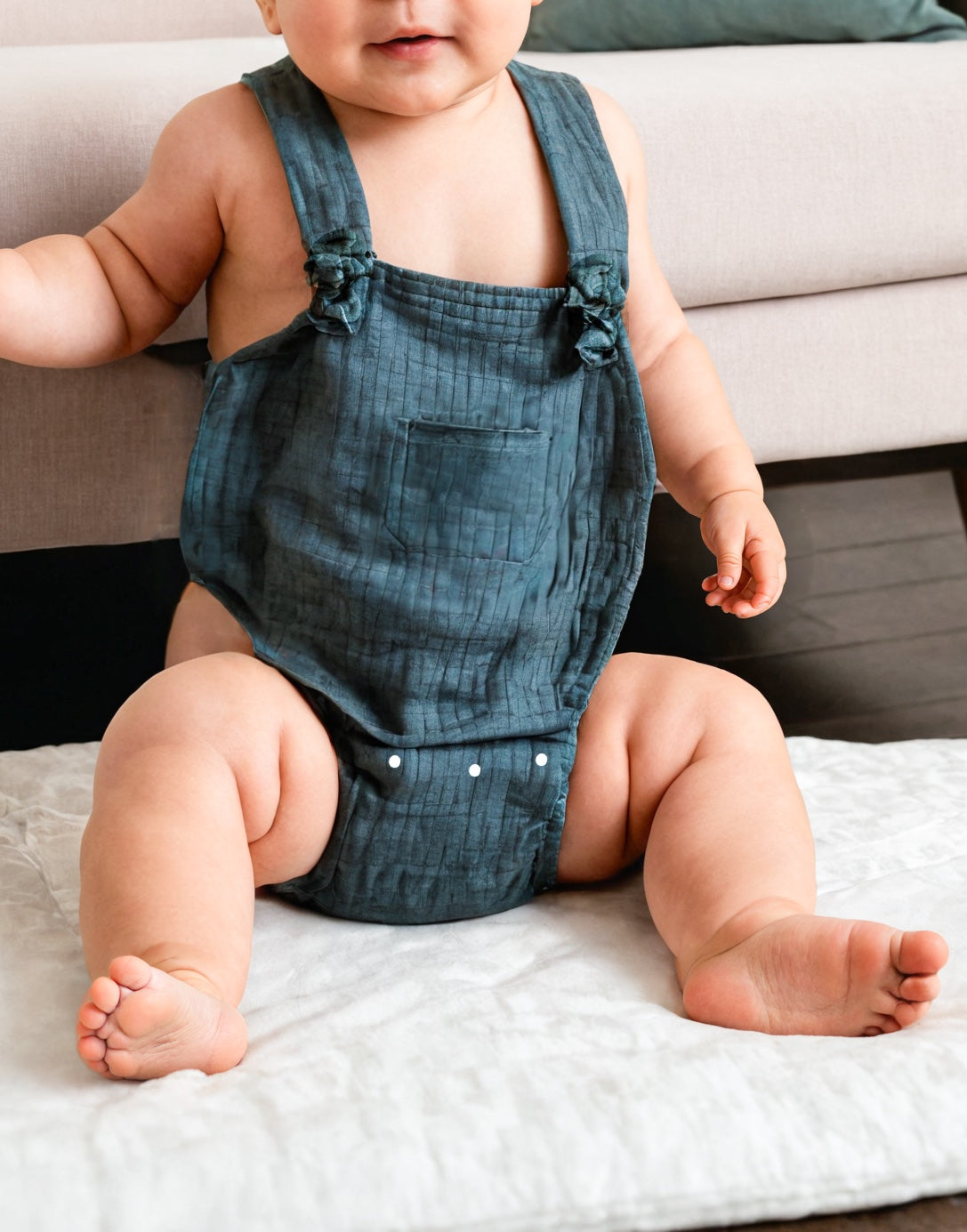 Side view of Baby Patch Pocket Romper.