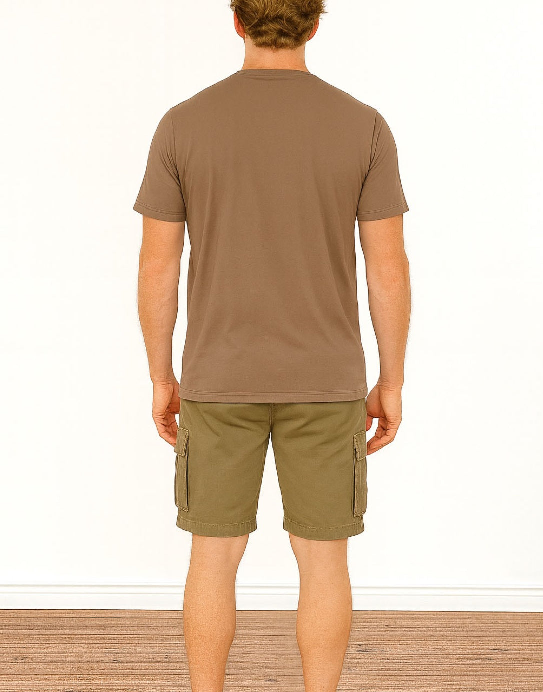 Back view of person wearing a brown Classic T-Shirt and cargo shorts on a white background
