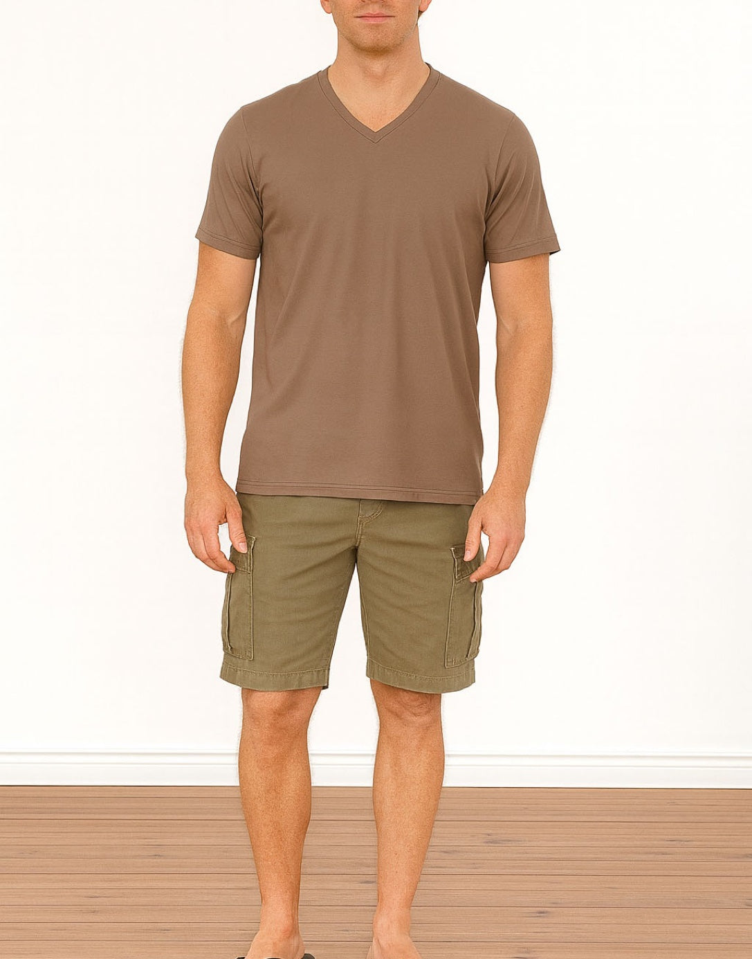 Man wearing a brown Classic V-Neck T-Shirt and green shorts on a white background