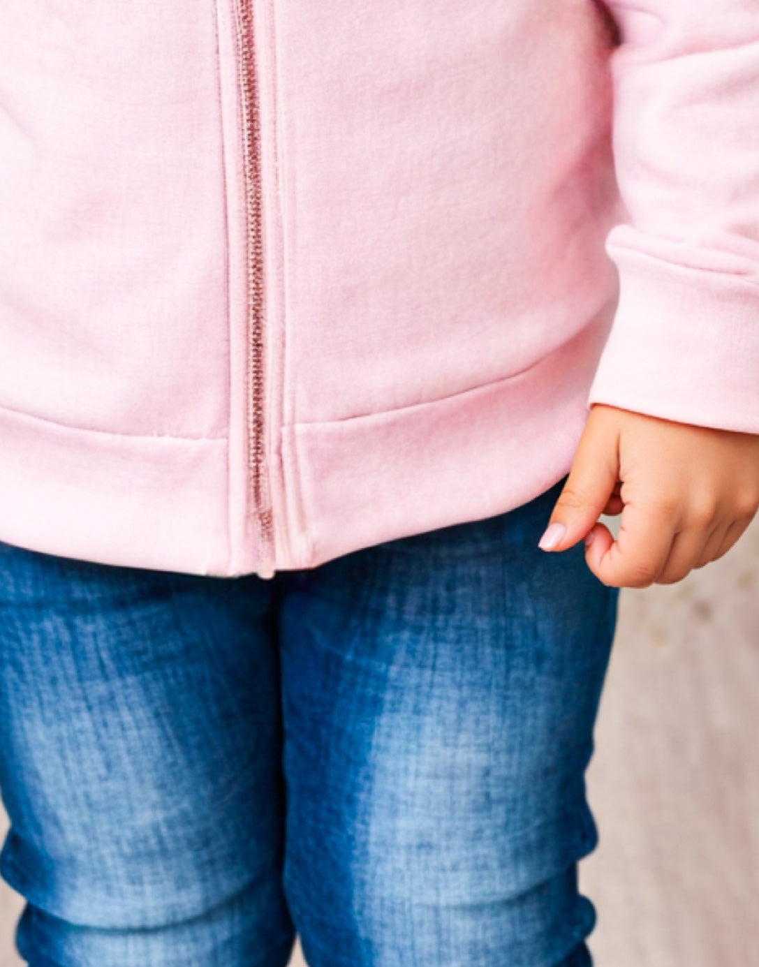 Hemline closeup of Girls Zip Up Hoodie Jacket.