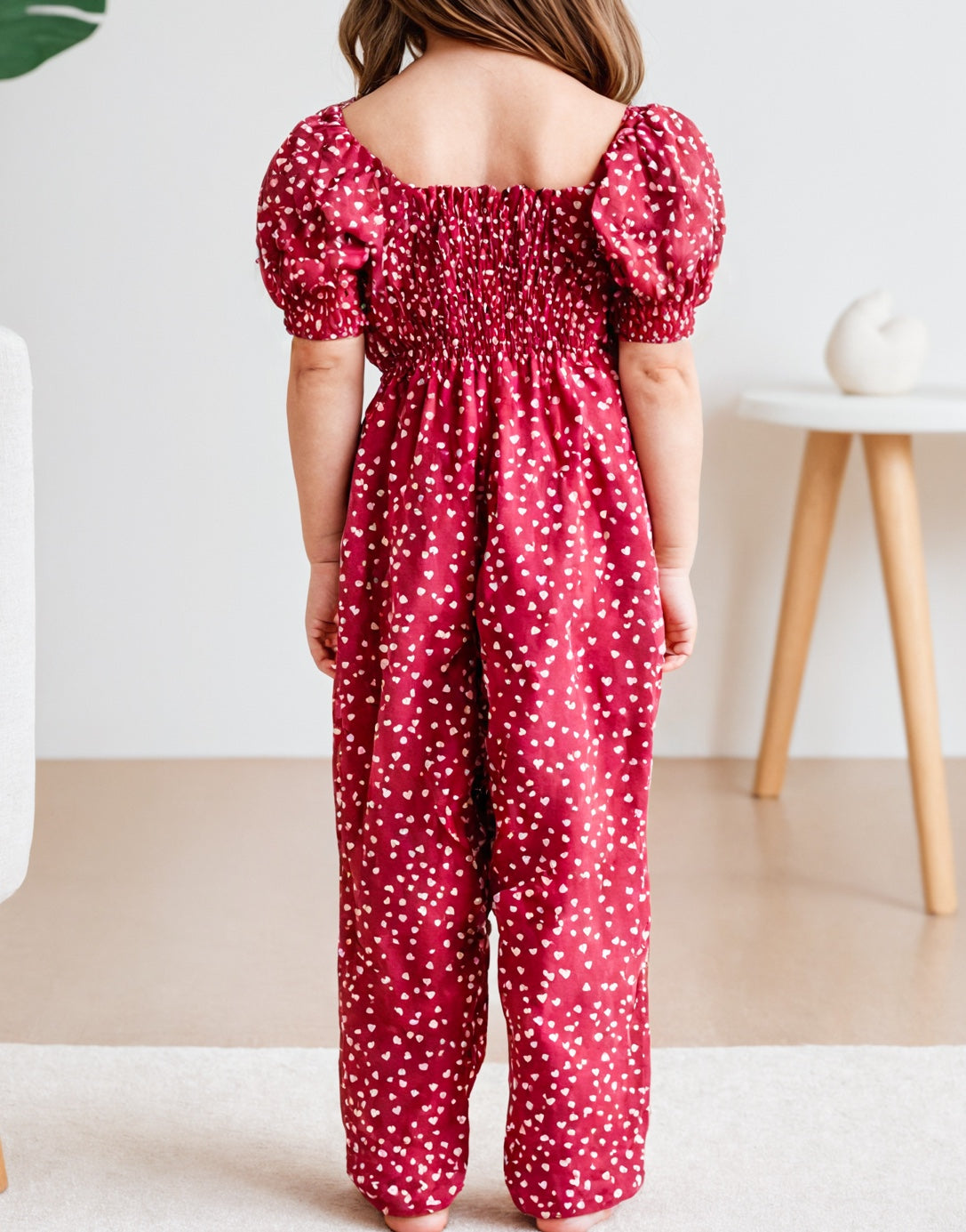 Back view of Girls Puff Sleeve Shirred Jumpsuit.