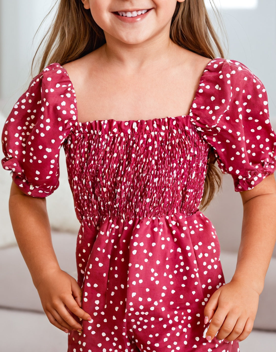 Front view of Girls Puff Sleeve Shirred Jumpsuit.