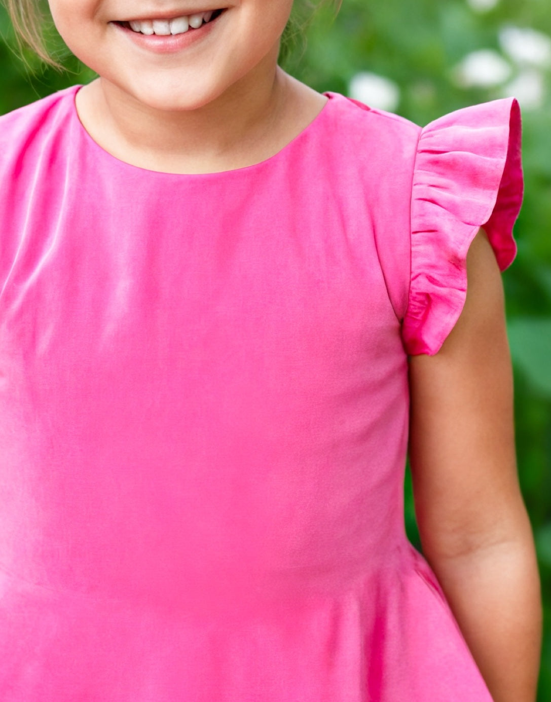 Neckline and sleeve closeup of Girls Ruffle Sleeve A-Line Dress.