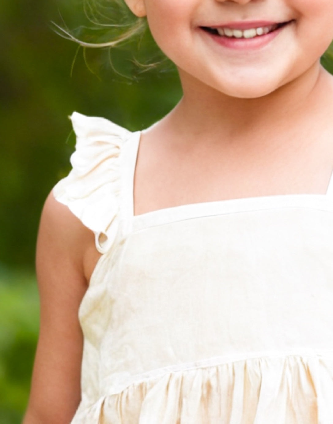 Neckline closeup of Girls Ruffle Sleeve Cami Dress.
