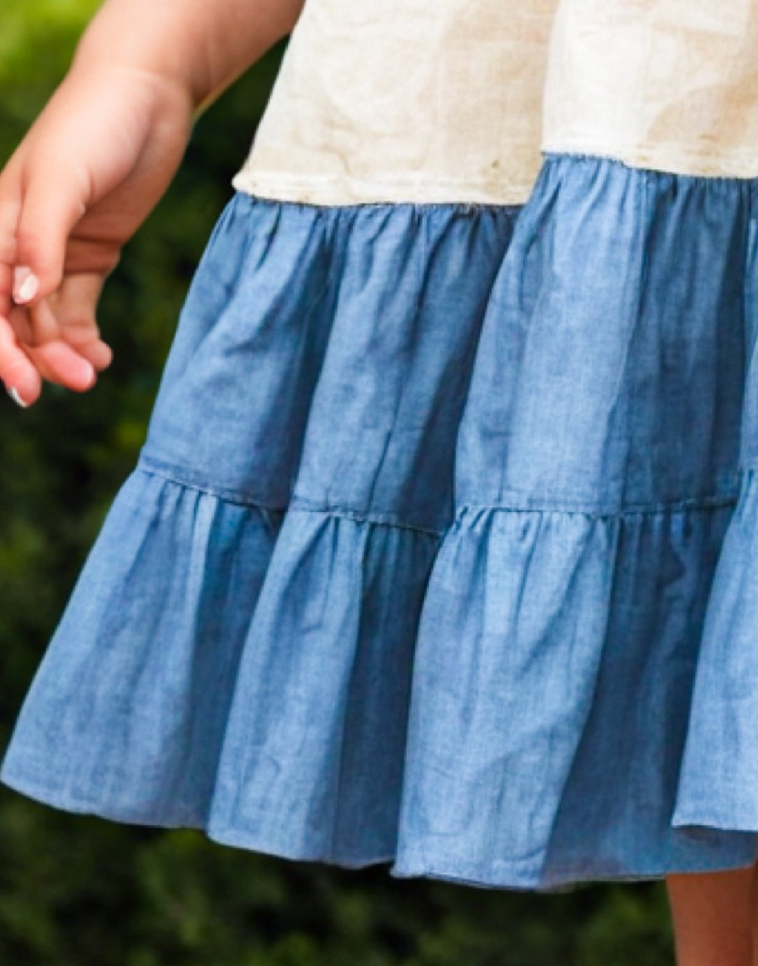 Hemline closeup of Girls Ruffle Sleeve Cami Dress.