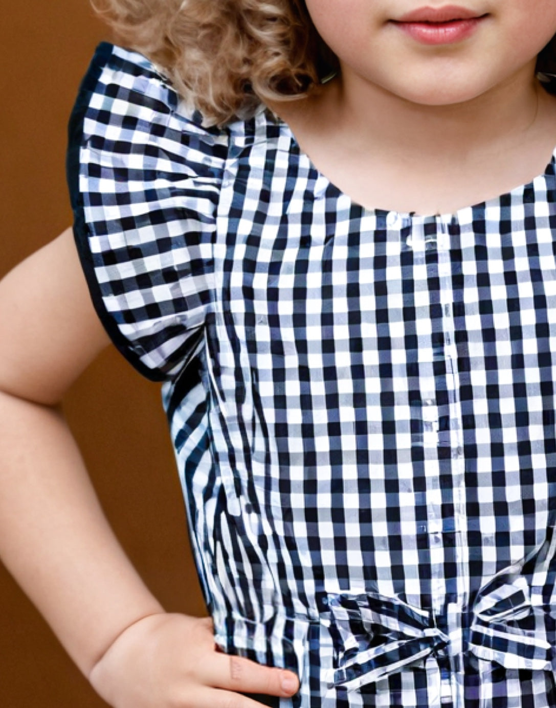 Closeup of Girls Ruffle Sleeve Jumpsuit.