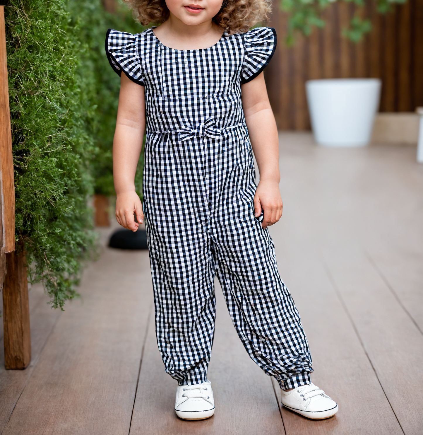 Front view of Girls Ruffle Sleeve Jumpsuit.