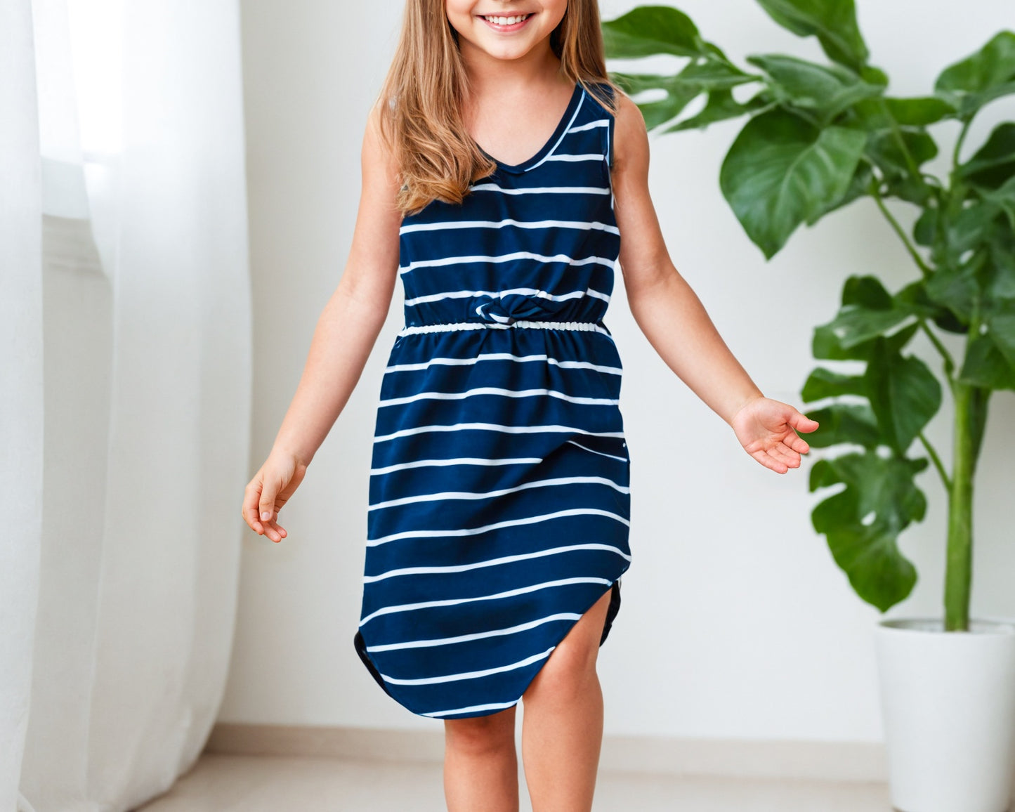 Front view of Girls Tie Front Curved Hem Knit Dress.