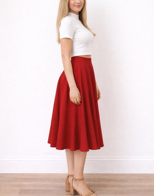 Side view of woman wearing a white top and red High Waist Midi Circle Skirt on a white background.