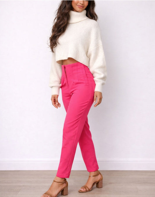 Side view of woman wearing a white sweater and bright pink High Waist Straight Leg Pants on a plain background.