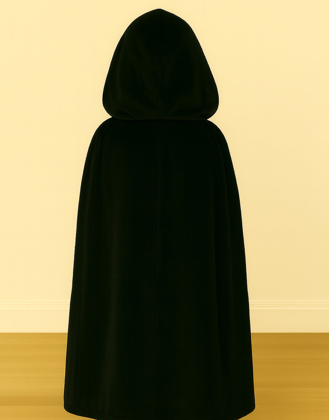 Back view of kids black hooded cloak on a plain background