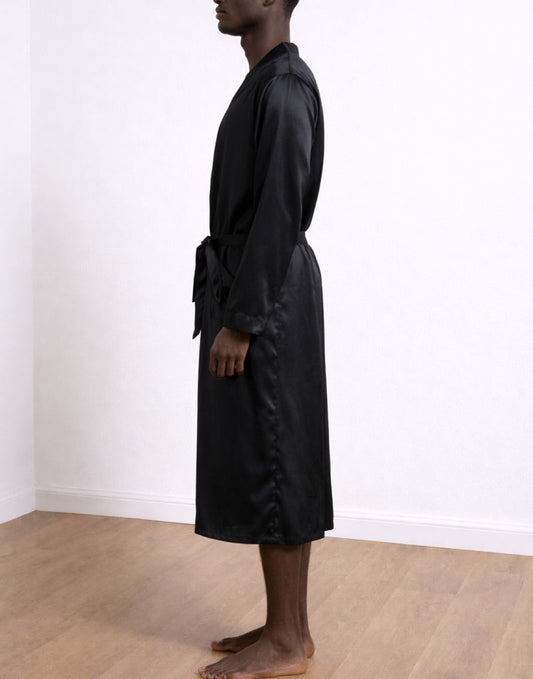 Side view of man wearing a gray textured Bathrobe against a plain background