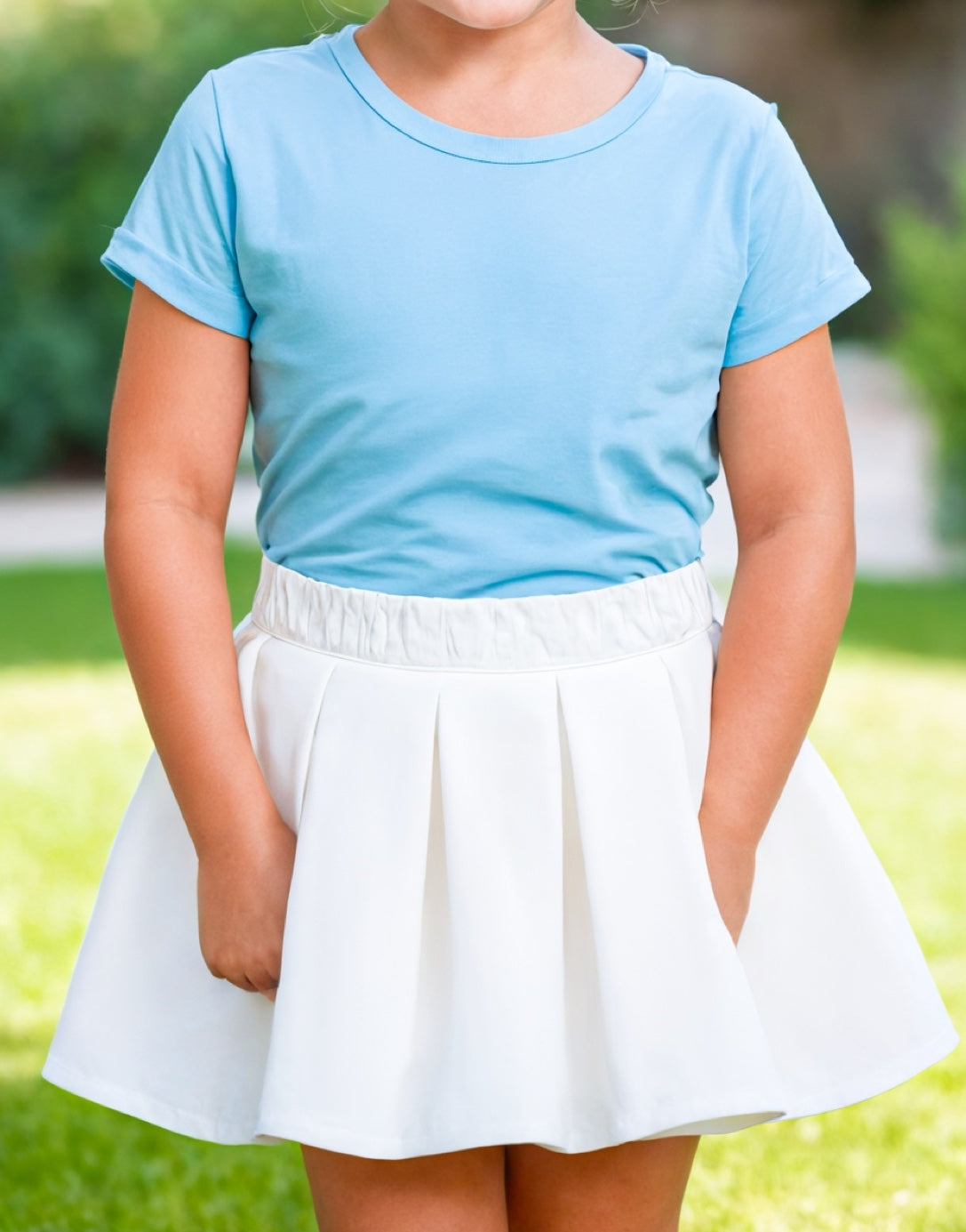 Front view of Girls Elastic Waist Pleated Skirt.