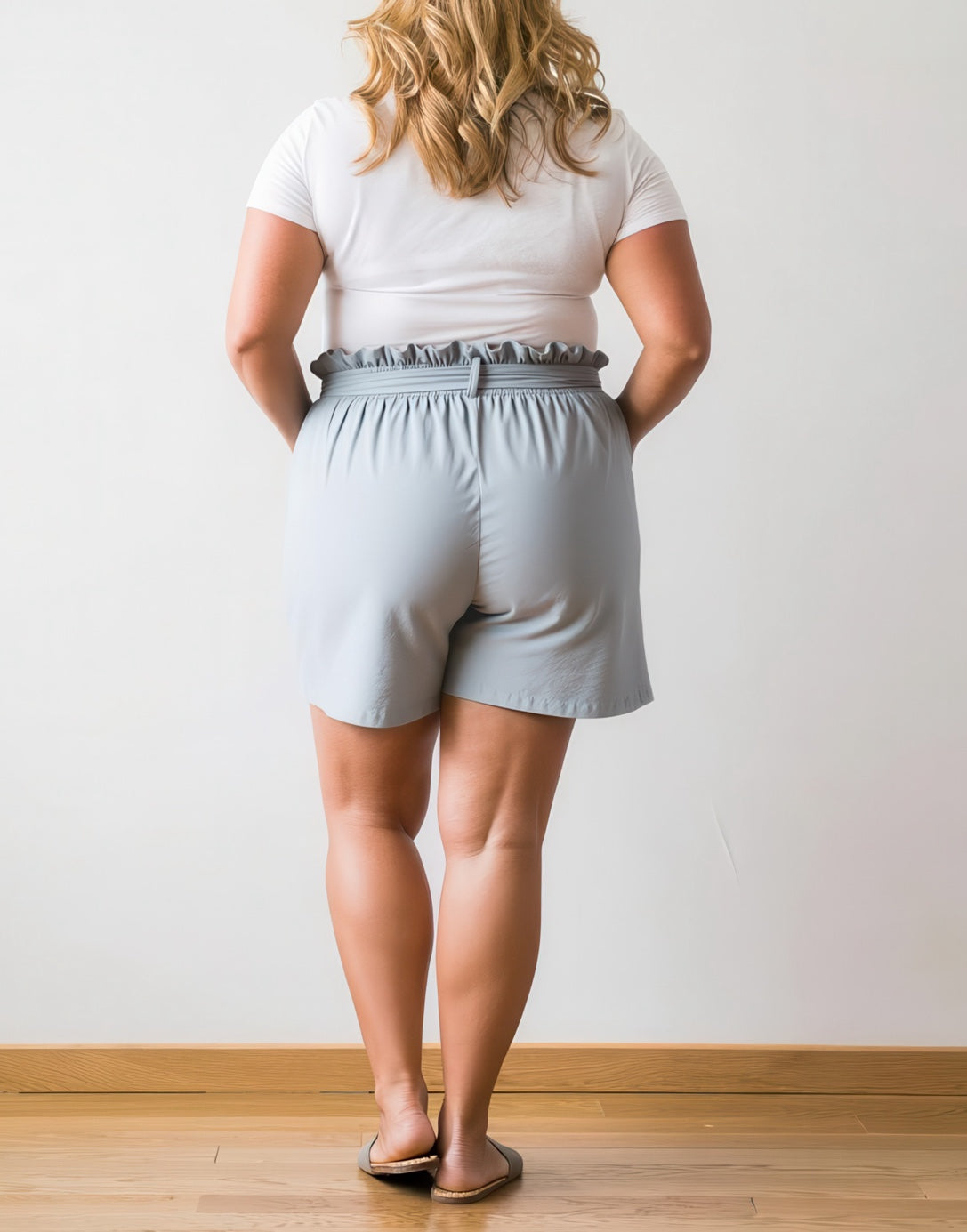 Back view of Plus Size Belted Patch Pocket Shorts.