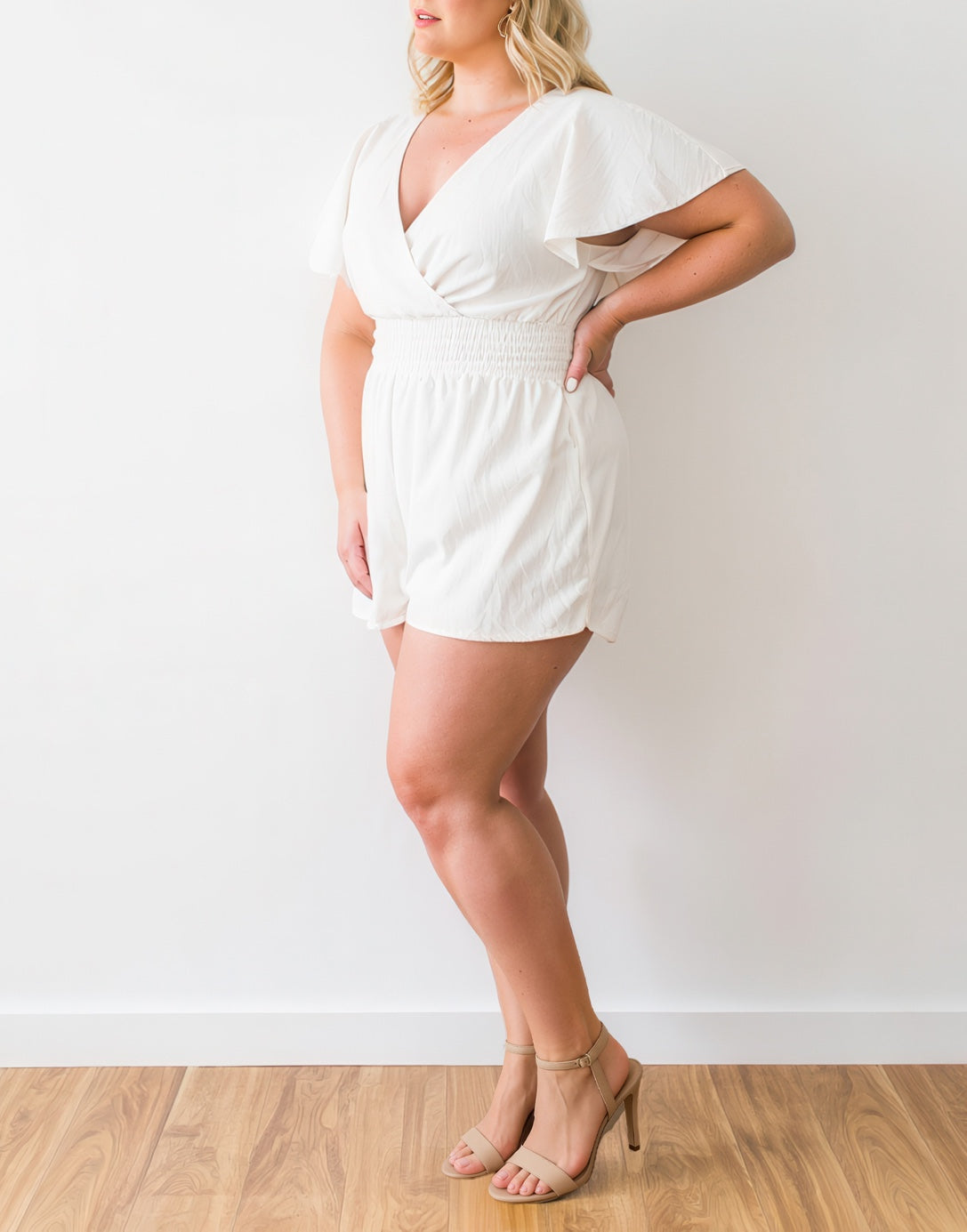 Side view of Plus Size Kimono Sleeve Surplice Romper.