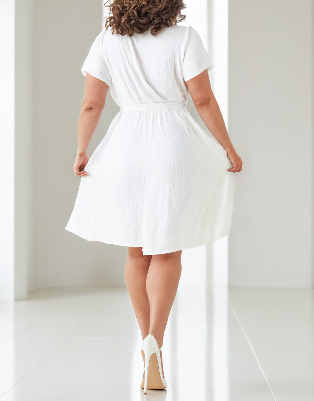 Back view of Plus Size Ruffle Hem Wrap Mini Dress.