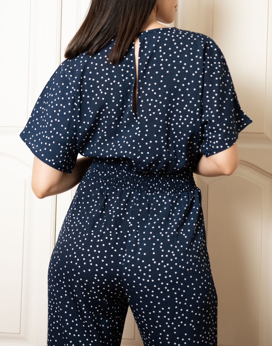 Closeup of Surplice Jumpsuit.