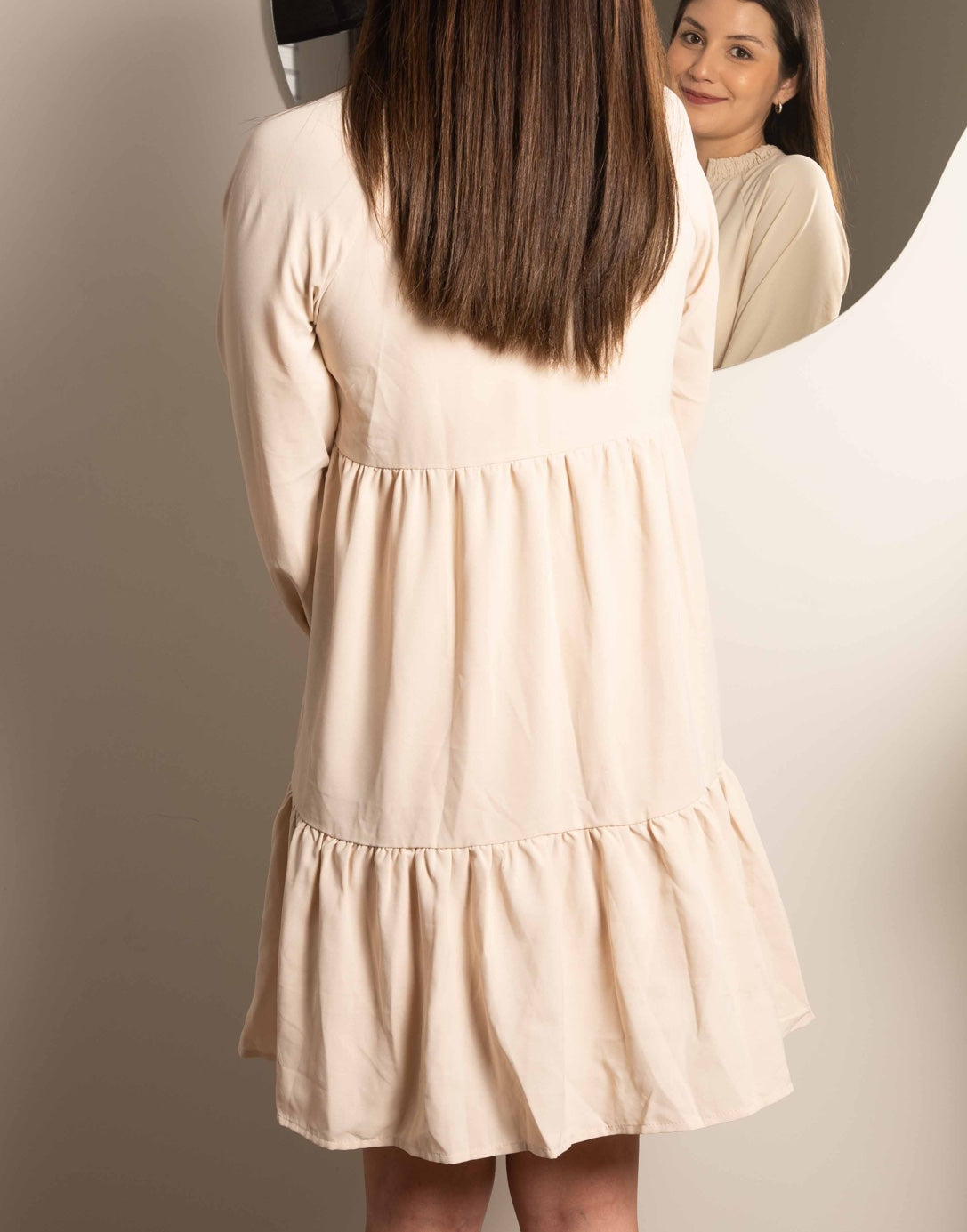 Back view of Tie Neck Smock Mini Dress.