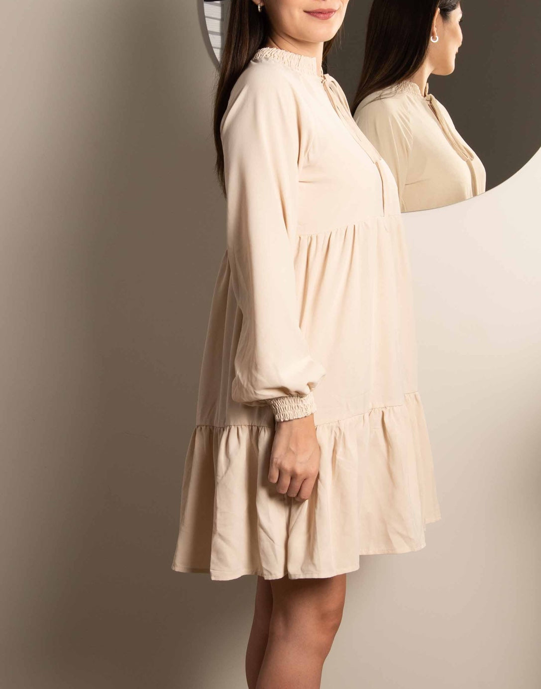 Side view of Tie Neck Smock Mini Dress.