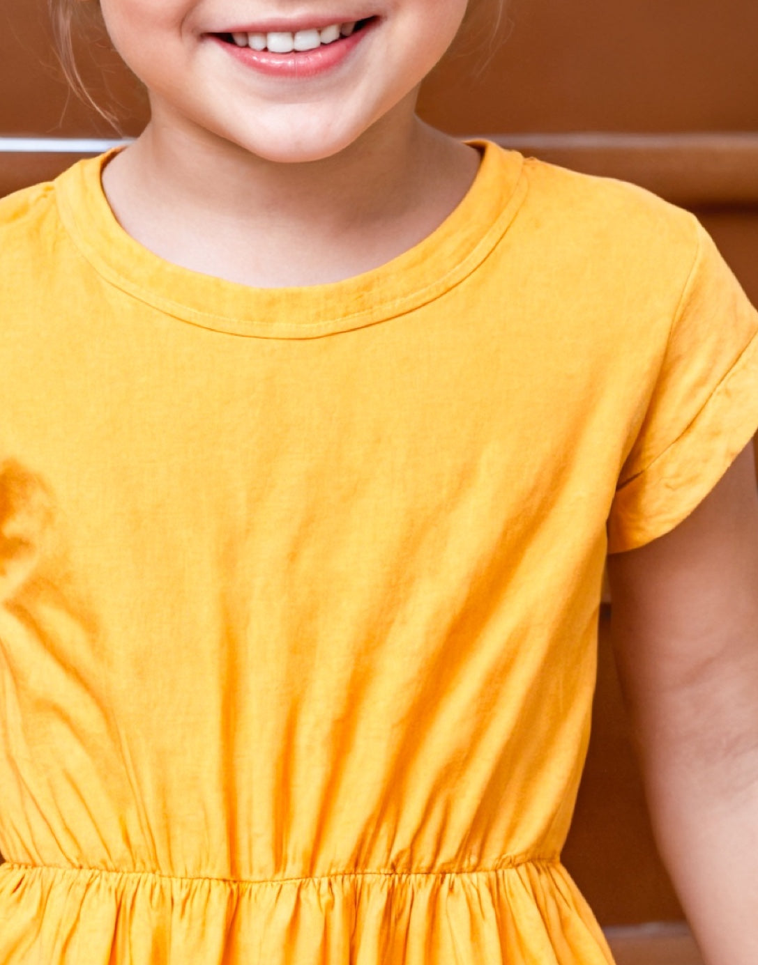 Neckline closeup of Toddler Girl Ruffle Hem T-Shirt Dress.