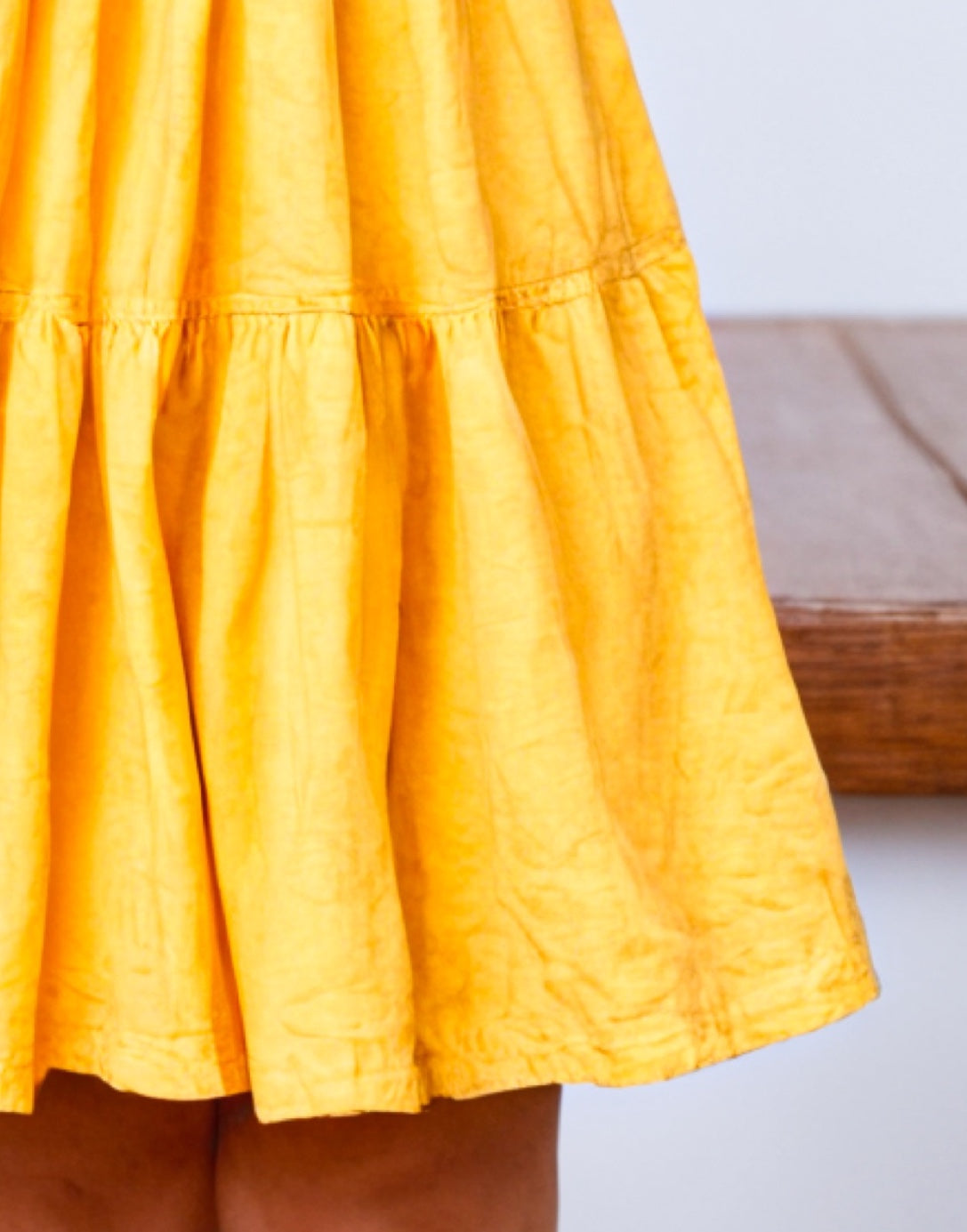 Hemline closeup of Toddler Girl Ruffle Hem T-Shirt Dress.