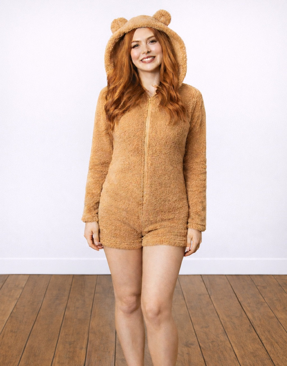 Woman wearing a brown 3D Ears Hooded Sleepwear Romper against a white background