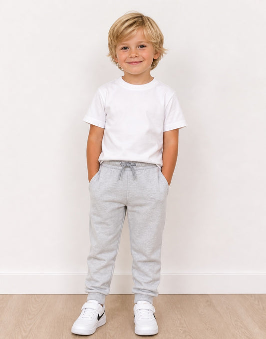 Child wearing a white t-shirt and gray Jogger Pants on a plain background