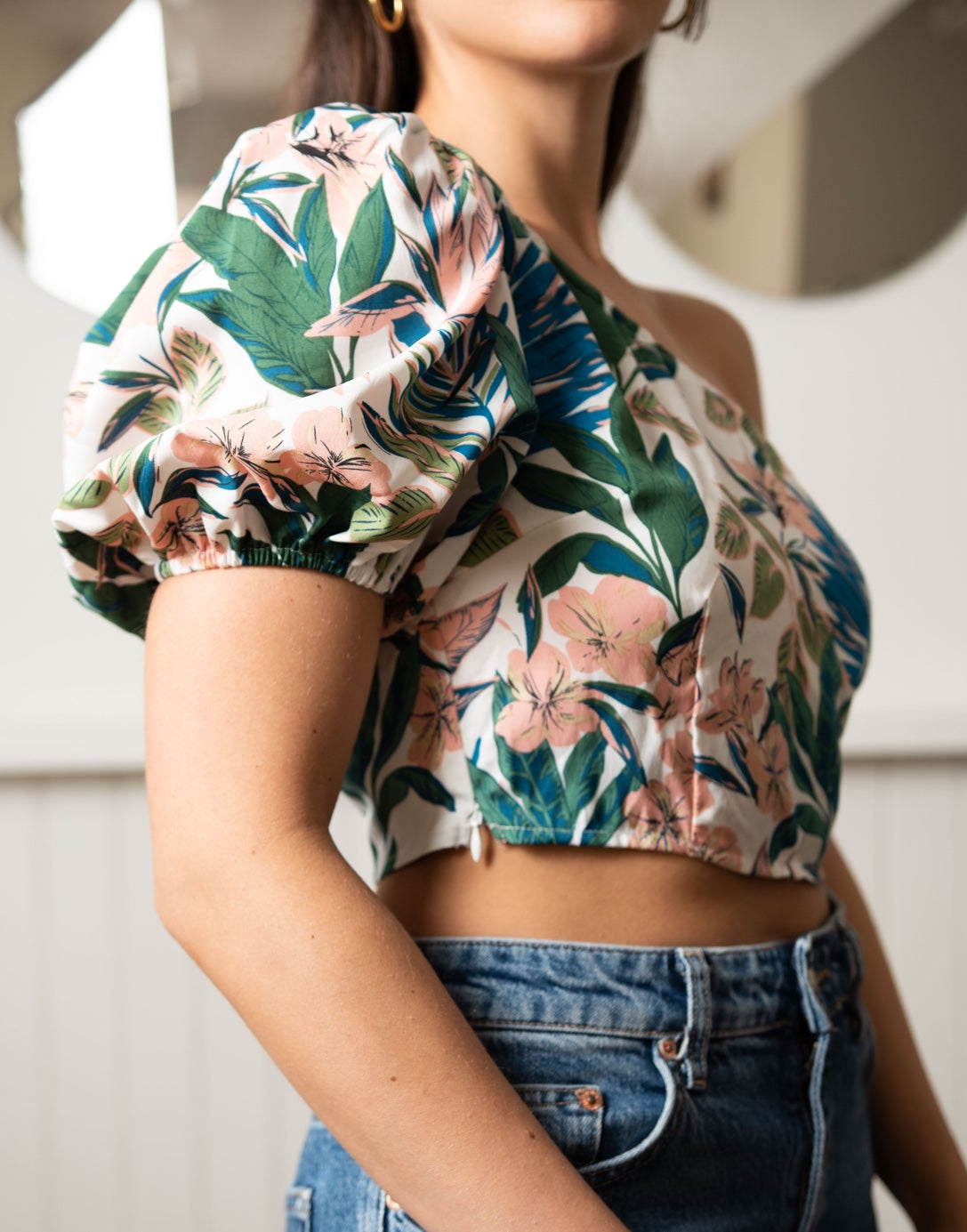 Closeup of One Shoulder Puff Sleeve Crop Top. 