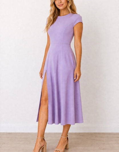 Side view of woman wearing a purple Cap Sleeve Midi Dress with a slit on a white background.