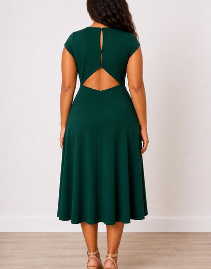 Back view of woman wearing a green Plus Size Open Back Cap Sleeve Midi Dress on a white background.