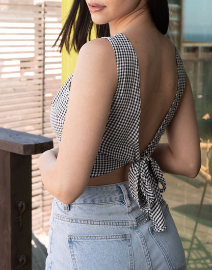 Side view of Tie Back Sleeveless Crop Top. 