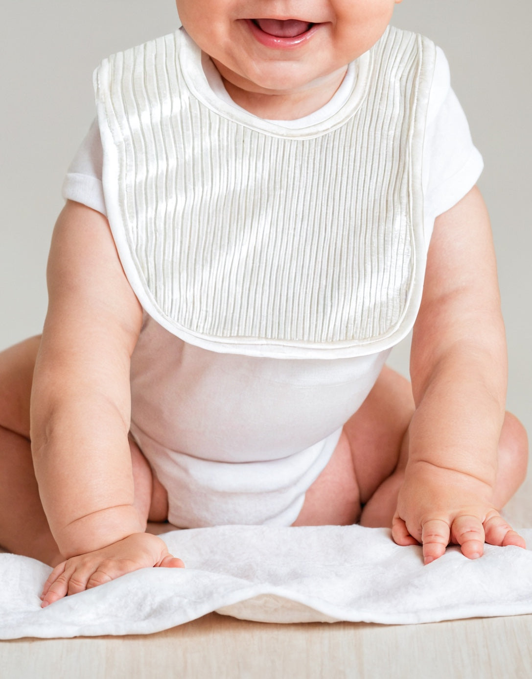 Front view of White Baby Bib.