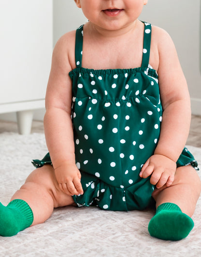 Closeup of Baby Girl Cami Ruffle Hem Romper.