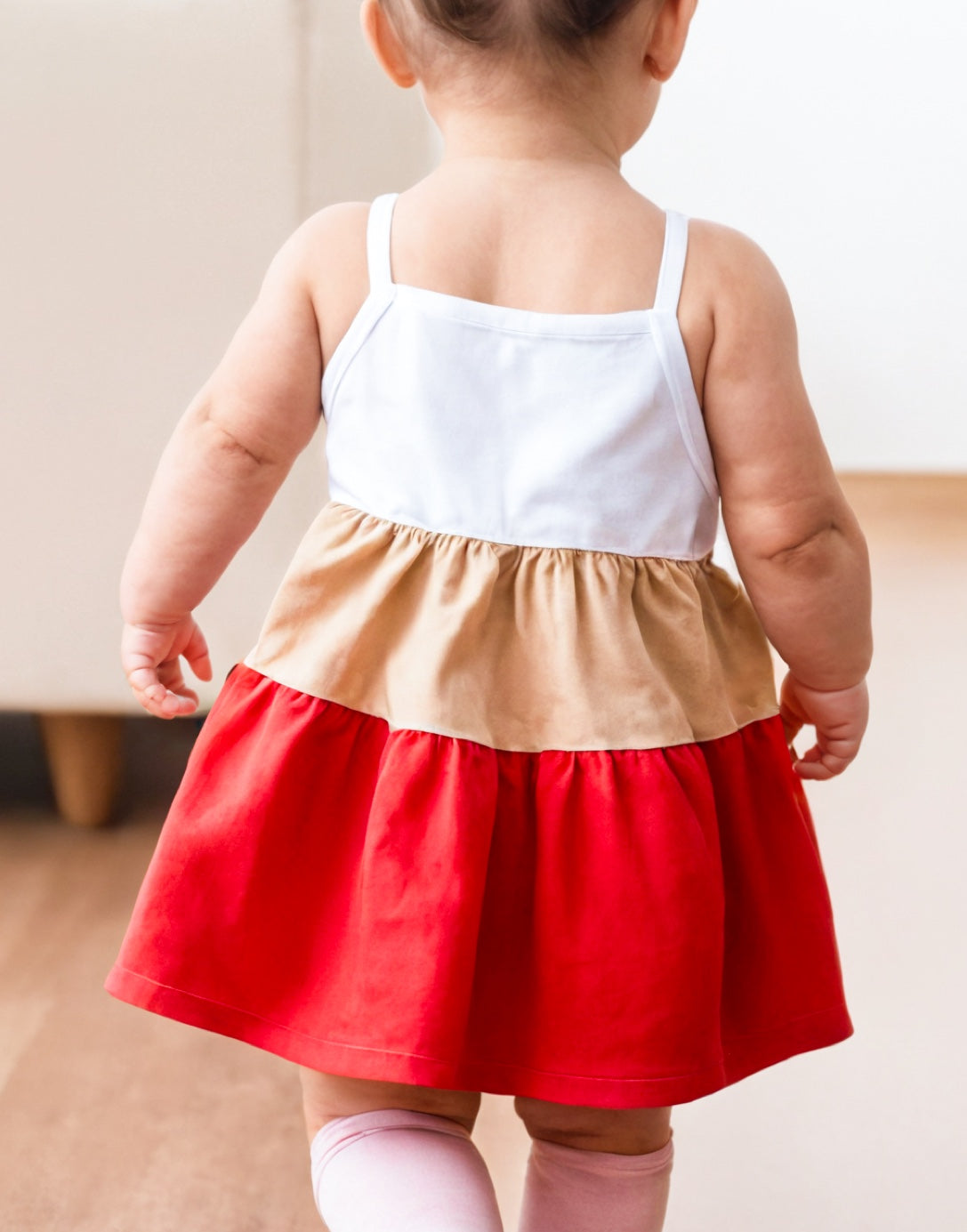 Back view of Baby Girl Colorblock Ruffle Hem Cami Dress.