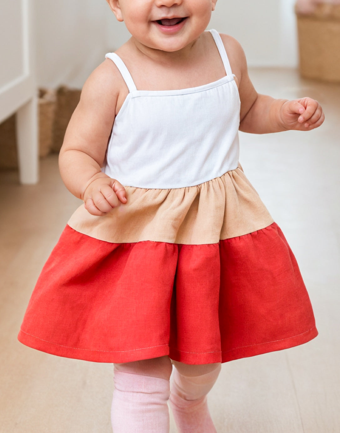 Side view of Baby Girl Colorblock Ruffle Hem Cami Dress.