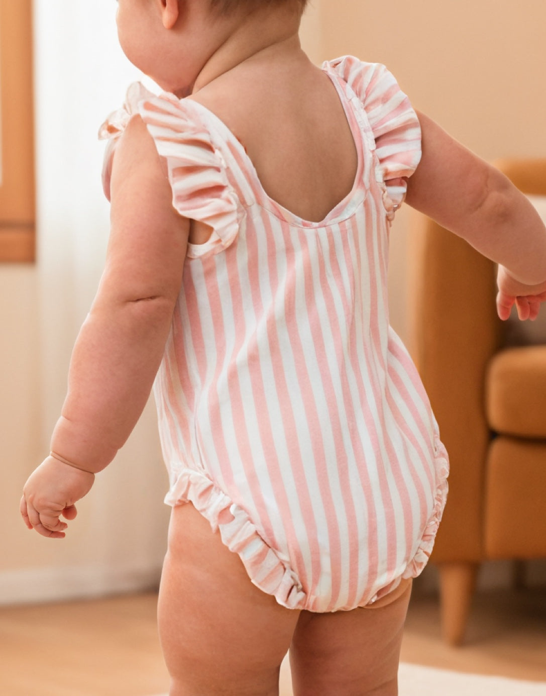 Back view of Baby Girl Ruffled One Piece Swimsuit.