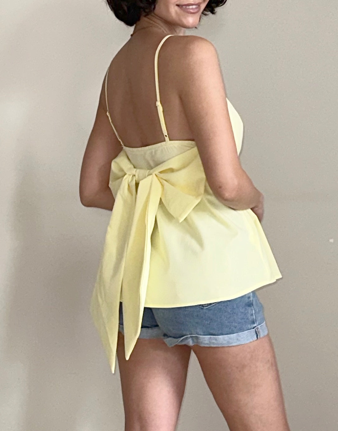 Side view of Bow Back Babydoll Cami Top.