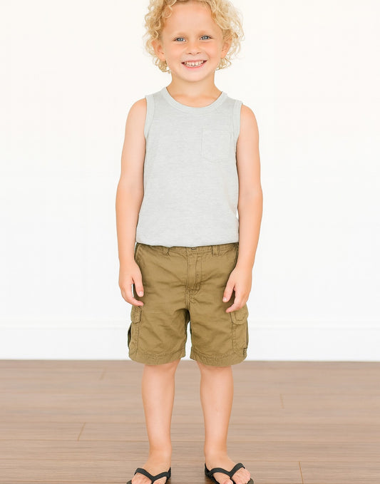 Child wearing a gray Round Neck Pocket Tank Top and green shorts on a white background