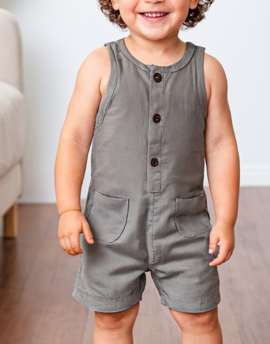 Front view of Boys Sleeveless Button Down Romper.
