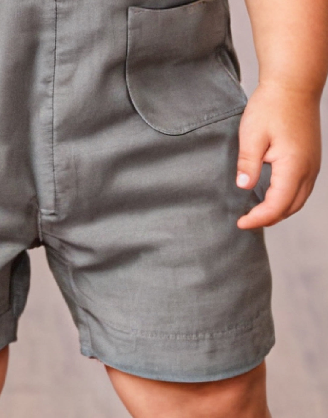 Pocket closeup of Boys Sleeveless Button Down Romper.
