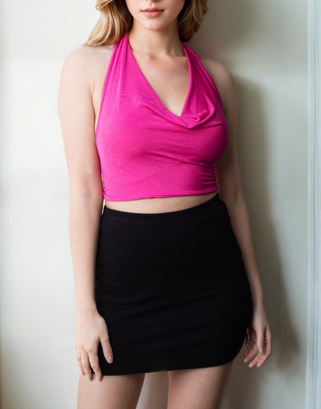 Full length photo of Cowl Halter Top with black mini skirt.