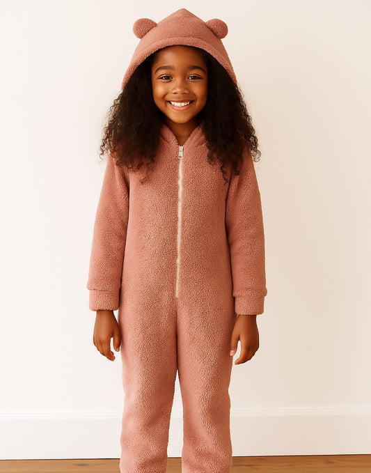 Child wearing a pink 3D Ear Hooded Sleep Jumpsuit with bear ears on a white background