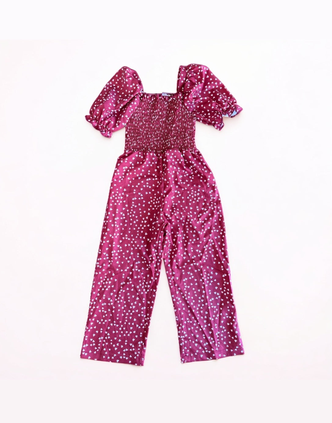 Front view of Girls Puff Sleeve Shirred Jumpsuit.