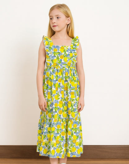 Girl wear a blue and yellow floral print Square Neck Ruffled Sleeve Maxi Dress with a plain background.