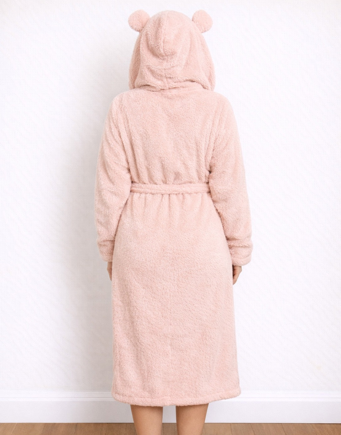Back view of person wearing a pink Hooded Bathrobe with bear ears on a white background