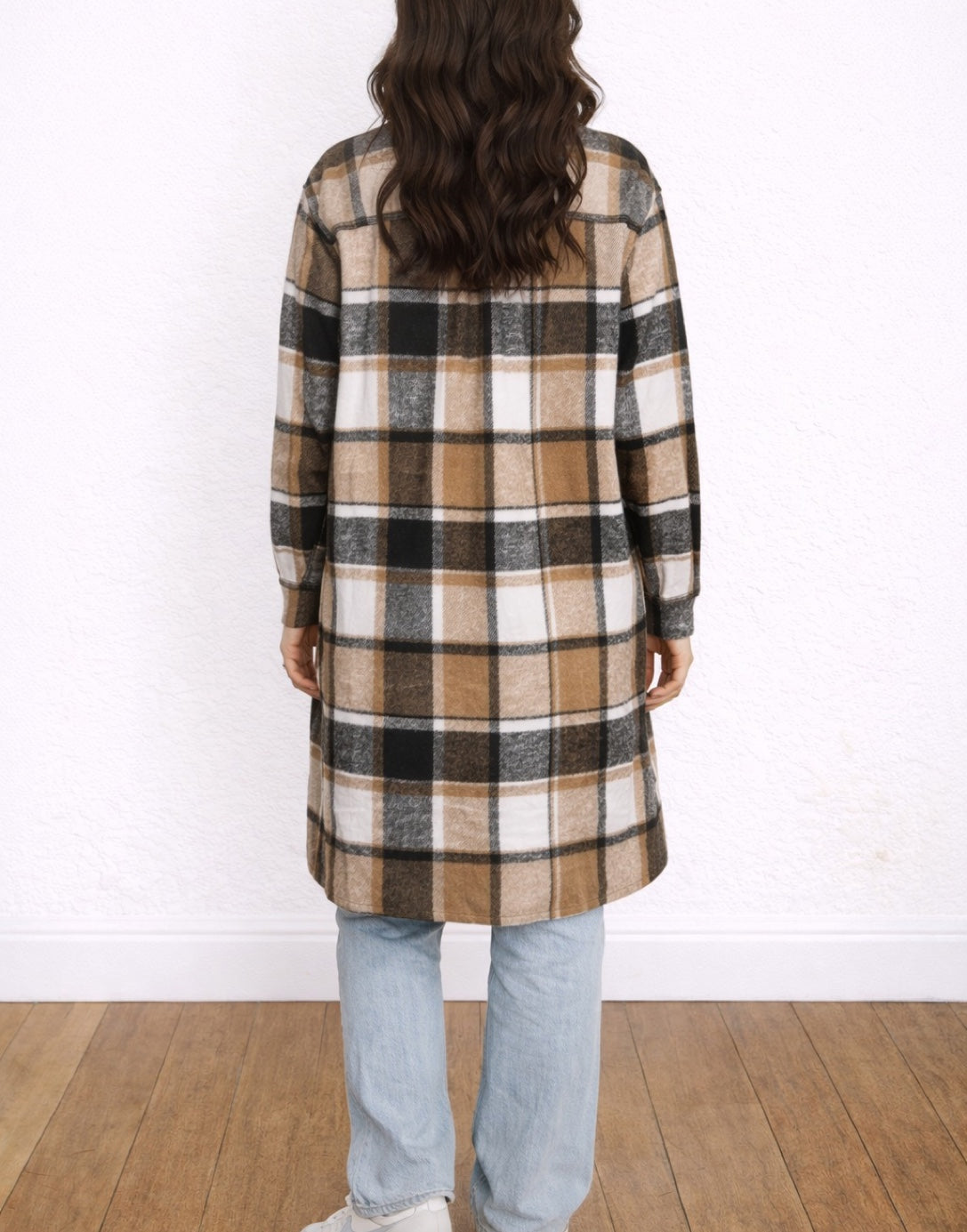 Back view of woman wearing a plaid Long Shirt Jacket and jeans on a white background
