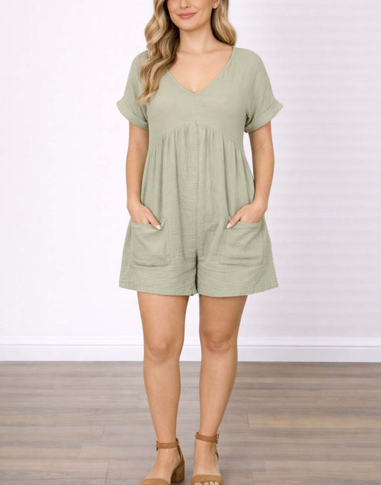 Woman wearing a green Patch Pocket Batwing Sleeve Romper against a white background.