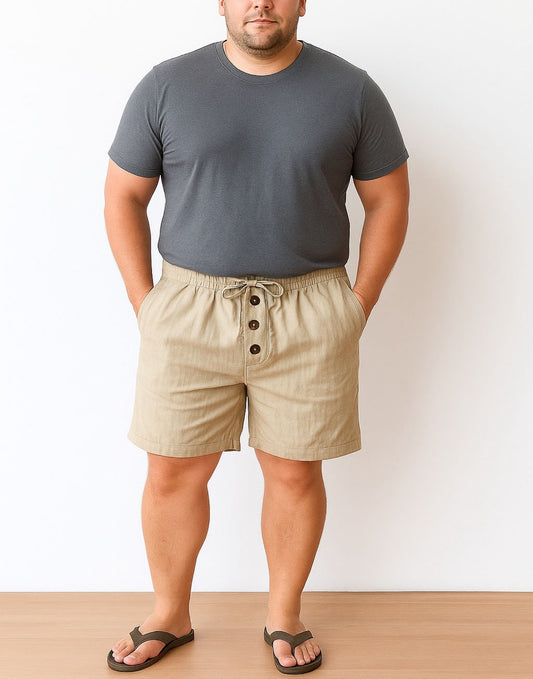 Man wearing a gray t-shirt and beige Plus Size Drawstring Button Front Shorts against a white background