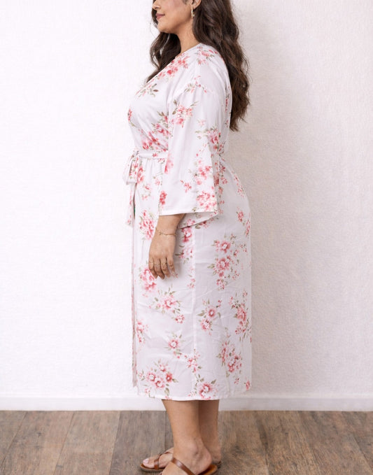 Side view of woman wearing a floral Plus Size Kimono Sleeve Robe against a plain background